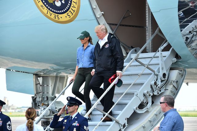 US President Donald Trump and First Lady Melania Trump arrive in Ellington Field in Houston on September 2, 2017. The Trumps arrived in Houston on Saturday to meet victims of the epic floods which devastated large parts of the fourth largest US city. / AFP PHOTO / Nicholas Kamm (Photo credit should read NICHOLAS KAMM/AFP/Getty Images)