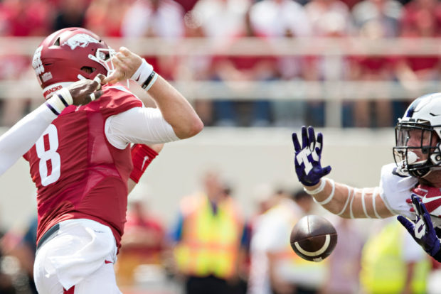FAYETTEVILLE, AR - SEPTEMBER 9: Austin Allen #8 of the Arkansas Razorbacks has a pass knocked out of his hands during a game against the TCU Horned Frogs at Donald W. Reynolds Razorback Stadium on September 9, 2017 in Fayetteville, Arkansas. (Photo by Wesley Hitt/Getty Images)