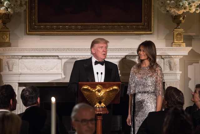 US President Donald Trump speaks beside First Lady Melania Trump as they host the White House Historical Association dinner at the White House in Washington, DC, on September 14, 2017. / AFP PHOTO / NICHOLAS KAMM (Photo credit should read NICHOLAS KAMM/AFP/Getty Images)
