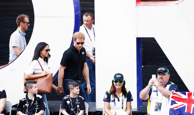 Britain's Prince Harry (R) arrives with girlfriend actress Meghan Markle at the wheelchair tennis event during the Invictus Games in Toronto, Ontario, Canada September 25, 2017. REUTERS/Mark Blinch -
