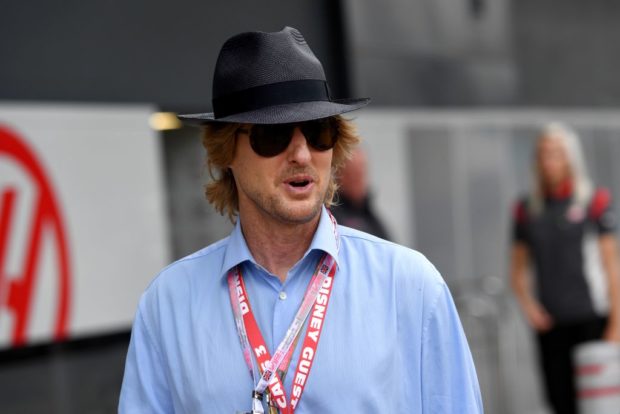US actor Owen Wilson walks in the pit lane ahead of the British Formula One Grand Prix at the Silverstone motor racing circuit in Silverstone, central England on July 16, 2017. (Photo credit: ANDREJ ISAKOVIC/AFP/Getty Images)
