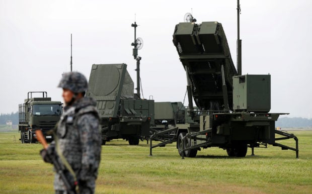 A Japan Self-Defense Forces (JSDF) soldier takes part in a drill to mobilise their Patriot Advanced Capability-3 (PAC-3) missile unit in response to a recent missile launch by North Korea, at U.S. Air Force Yokota Air Base in Fussa on the outskirts of Tokyo, Japan August 29, 2017. REUTERS/Issei Kato 