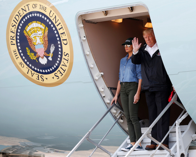 U.S. President Donald Trump and first lady Melania Trump wave from Air Force One after arriving at Ellington Field to meet with flood survivors and volunteers who assisted in relief efforts in the aftermath of Hurricane Harvey, in Houston, Texas, U.S., September 2, 2017. REUTERS/Kevin Lamarque - RC16810545E0