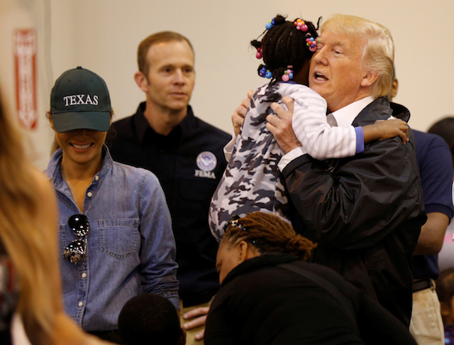 U.S. President Donald Trump and first lady Melania Trump greet children at the NRG Center where they met with flood survivors of Hurricane Harvey, in Houston, Texas, U.S., September 2, 2017. REUTERS/Kevin Lamarque - RC119D7748C0