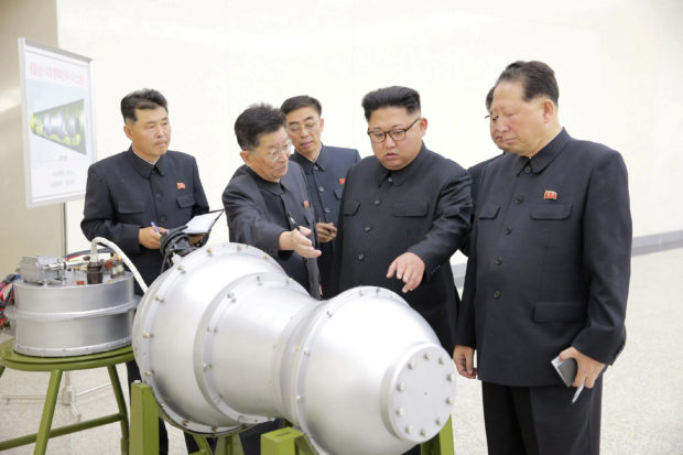 North Korean leader Kim Jong Un provides guidance with Ri Hong Sop (2nd L) and Hong Sung Mu (R) on a nuclear weapons program in this undated photo released by North Korea's Korean Central News Agency (KCNA) in Pyongyang September 3, 2017. KCNA via REUTERS 