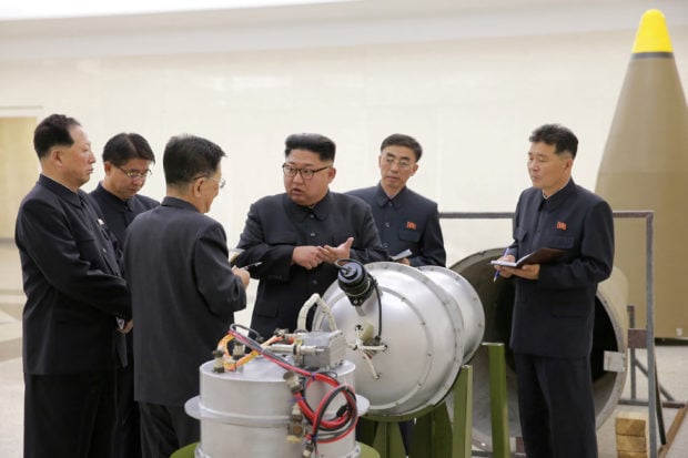 North Korean leader Kim Jong Un provides guidance with Ri Hong Sop (3rd L) and Hong Sung Mu (L) on a nuclear weapons program in this undated photo released by North Korea's Korean Central News Agency (KCNA) in Pyongyang September 3, 2017. KCNA via REUTERS