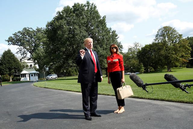 U.S. President Donald Trump talks to the media about Hurricane Irma next to first lady Melania Trump on the South Lawn the White House upon their return to Washington, U.S., from Camp David, September 10, 2017. REUTERS/Yuri Gripas - RC1BA4657E10