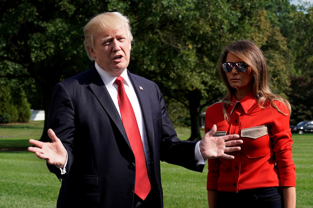 U.S. President Donald Trump talks to the media about Hurricane Irma next to first lady Melania Trump on the South Lawn the White House upon their return to Washington, U.S., from Camp David, September 10, 2017. REUTERS/Yuri Gripas - RC14148EA770