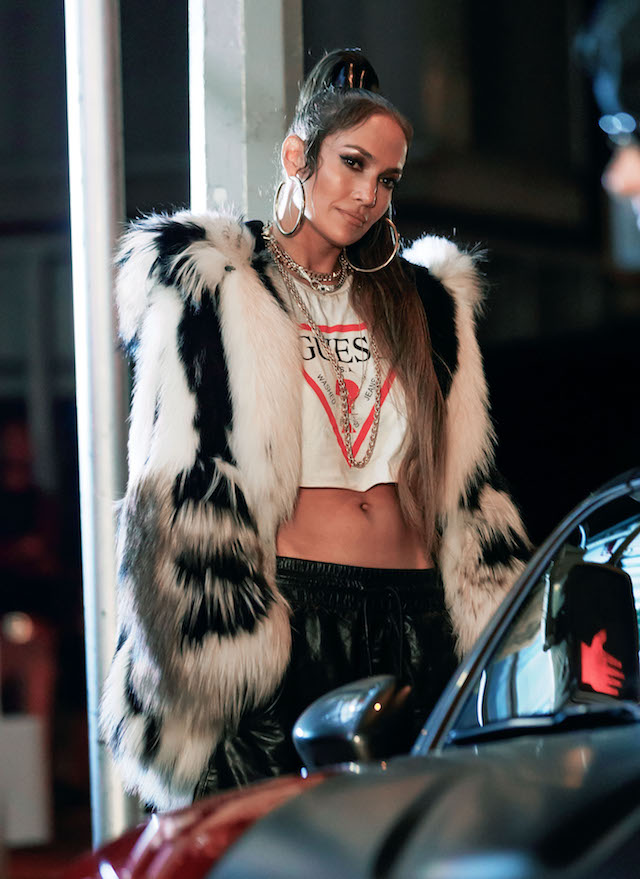 Jennifer Lopez recreates 2002 look in ab-flashing furry outfit and hoop earrings as she joins hunky tattooed co-star on set of new music video for Fiat in NYC. <P> Pictured: Jennifer Lopez <B>Ref: SPL1566787 010917 </B><BR /> Picture by: XactpiX/Splash