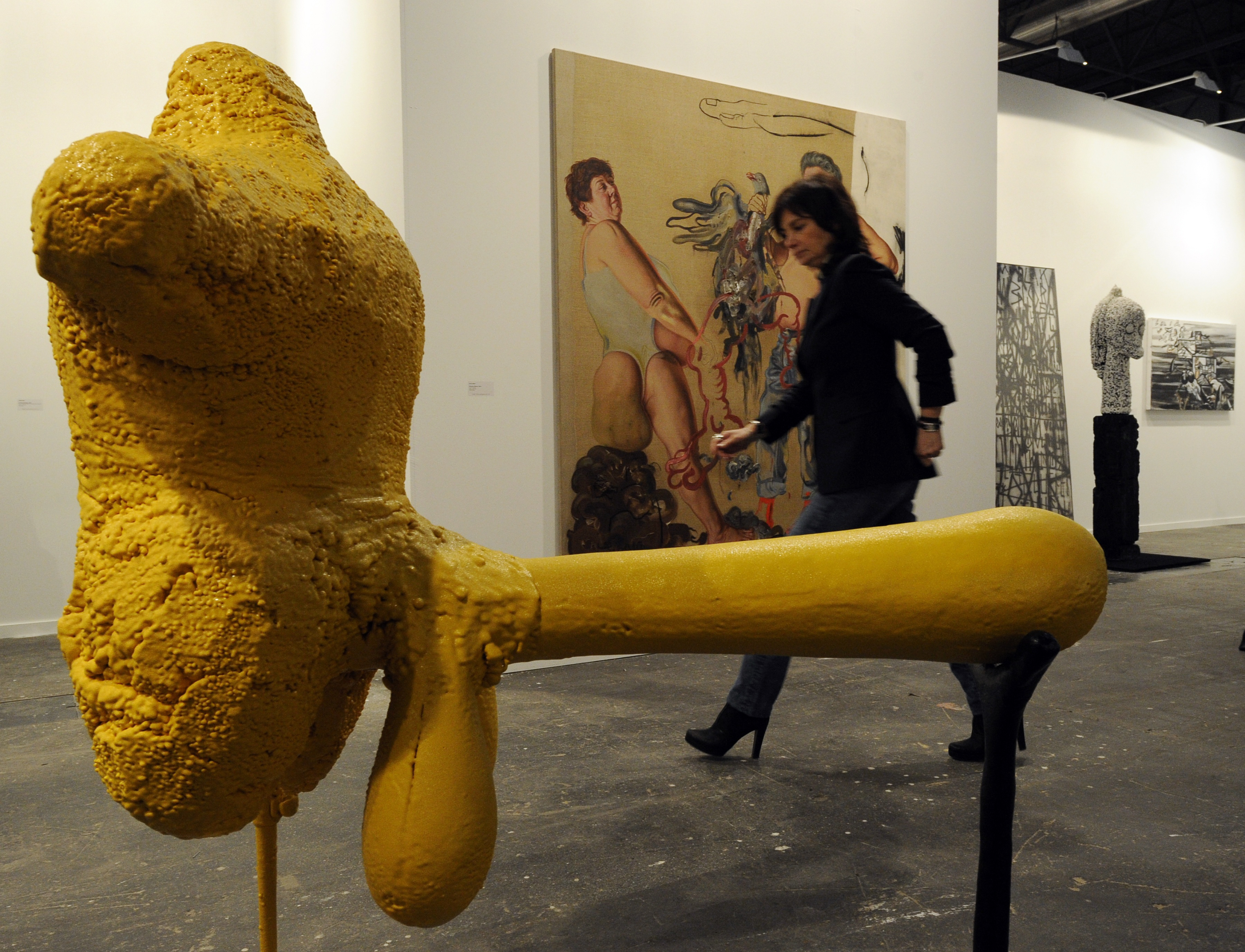 A woman walks past a sculpture, "Le Magnifique," by Dutch artist Atelier Van Lieshout shown at the Belgian Tim Van Laere Gallery on February 16, 2011 during the ARCO International Contemporary Art Fair in Madrid. [JAVIER SORIANO/AFP/Getty Images]