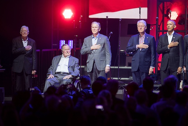 COLLEGE STATION, TX - OCTOBER 21: (L-R) Former United States Presidents Jimmy Carter, George H.W. Bush, George W. Bush, Bill Clinton, and Barack Obama address the audience during the 'Deep from the Heart: The One America Appeal Concert' at Reed Arena on the campus of Texas A&M University on October 21, 2017 in College Station, Texas. (Photo by Rick Kern/Getty Images for Ford Motor Company)