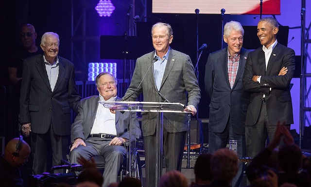 COLLEGE STATION, TX - OCTOBER 21: (L-R) Former United States Presidents Jimmy Carter, George H.W. Bush, George W. Bush, Bill Clinton, and Barack Obama address the audience during the 'Deep from the Heart: The One America Appeal Concert' at Reed Arena on the campus of Texas A&M University on October 21, 2017 in College Station, Texas. (Photo by Rick Kern/Getty Images for Ford Motor Company)