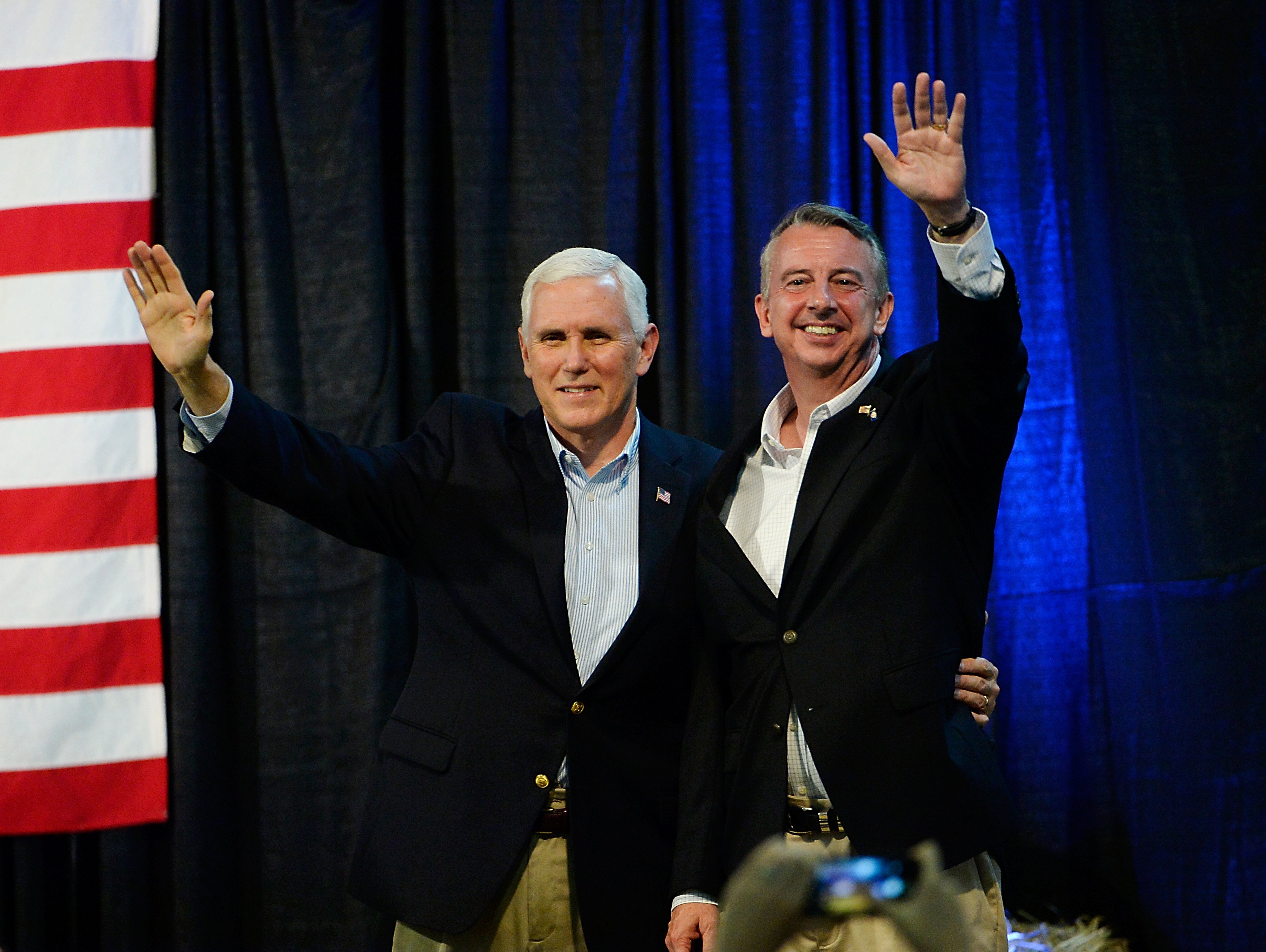 ABINGDON, VA - OCTOBER 14: U.S. Vice President Mike Pence, left, and gubernatorial candidate Ed Gillespie, R-VA, wave during a campaign rally at the Washington County Fairgrounds on October 14, 2017 in Abingdon, Virginia. Virginia voters head to the polls on Nov. 7. (Photo by Sara D. Davis/Getty Images)