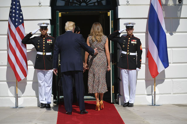 US President Donald Trump and First Lady Melania Trump walk into the White House after greeting Thailand's Prime Minister Prayut Chan-o-cha and wife Naraporn Chan-ocha upon arrival at the South Portico on October 2, 2017 in Washington, DC. / AFP PHOTO / MANDEL NGAN (Photo credit should read MANDEL NGAN/AFP/Getty Images)