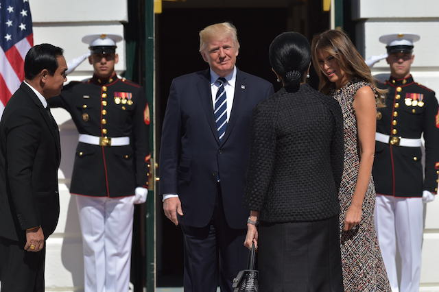 US President Donald Trump and First Lady Melania Trump greets Thailand's Prime Minister Prayut Chan-o-cha and wife Naraporn Chan-ocha upon arrival at the South Portico of the White House on October 2, 2017 in Washington, DC. / AFP PHOTO / MANDEL NGAN (Photo credit should read MANDEL NGAN/AFP/Getty Images)