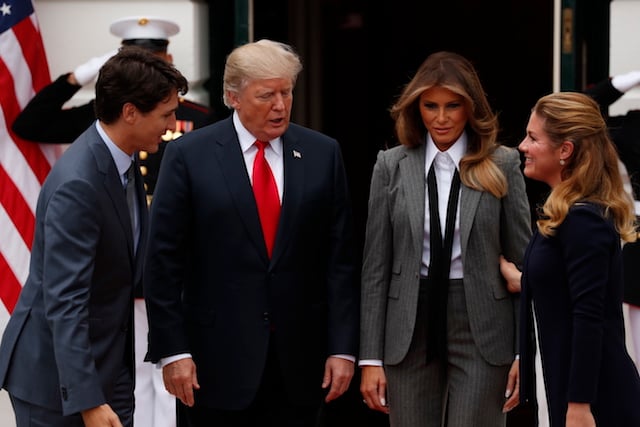 U.S. President Donald Trump and first lady Melania Trump welcome Canadian Prime Minister Justin Trudeau and Mrs. GrÈgoire Trudeau (R) at the White House in Washington, U.S., October 11, 2017. REUTERS/Jonathan Ernst