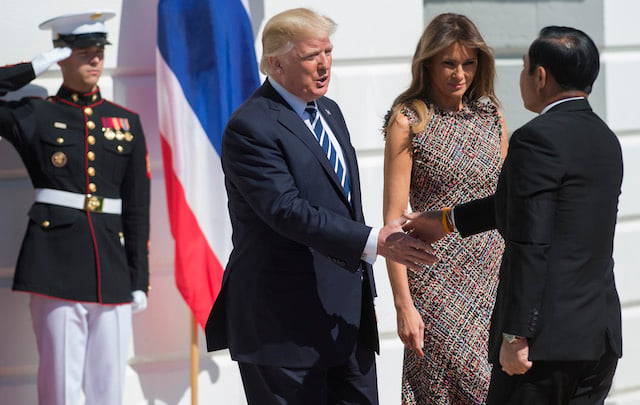 US President Donald Trump and First Lady Melania Trump greet Thai Junta Chief Prayut Chan-O-Cha as he arrives at the South Lawn of the White House in Washington, DC, October 2, 2017. / AFP PHOTO / SAUL LOEB (Photo credit should read SAUL LOEB/AFP/Getty Images)