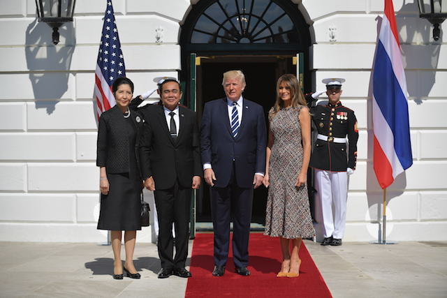 US President Donald Trump and First Lady Melania Trump greets Thailand's Prime Minister Prayut Chan-o-cha and wife Naraporn Chan-ocha upon arrival at the South Portico of the White House on October 2, 2017 in Washington, DC. / AFP PHOTO / MANDEL NGAN (Photo credit should read MANDEL NGAN/AFP/Getty Images)