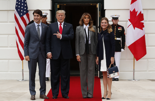 U.S. President Donald Trump and first lady Melania Trump welcome Canadian Prime Minister Justin Trudeau and Mrs. GrÈgoire Trudeau (R) at the White House in Washington, U.S., October 11 2017. REUTERS/Jonathan Ernst - HP1EDAB1DSV6V