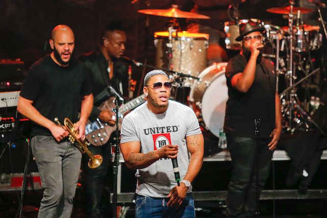 Rapper Nelly performs with the hip hop group The Roots at the Live Nation Celebration National Concert Day at Irving Plaza on May 1, 2017 in New York. / AFP PHOTO / EDUARDO MUNOZ ALVAREZ (Photo credit should read EDUARDO MUNOZ ALVAREZ/AFP/Getty Images)