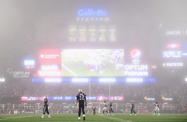 FOXBORO, MA - OCTOBER 22: Tom Brady #12 of the New England Patriots looks on as fog falls on the field during the fourth quarter of a game against the Atlanta Falcons at Gillette Stadium on October 22, 2017 in Foxboro, Massachusetts. (Photo by Billie Weiss/Getty Images)
