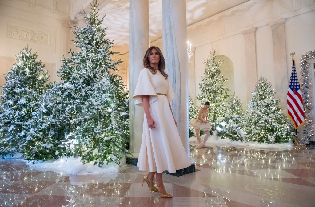 TOPSHOT - US First Lady Melania Trump stands in the Grand Foyer as she tours Christmas decorations at the White House in Washington, DC, November 27, 2017. / AFP PHOTO / SAUL LOEB (Photo credit should read SAUL LOEB/AFP/Getty Images)