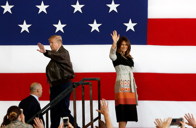 U.S. President Donald Trump and first lady Melania Trump wave on stage at U.S. Air Force Yokota Air Base in Fussa, on the outskirts of Tokyo, Japan, November 5, 2017. REUTERS/Toru Hanai - RC14299080F0