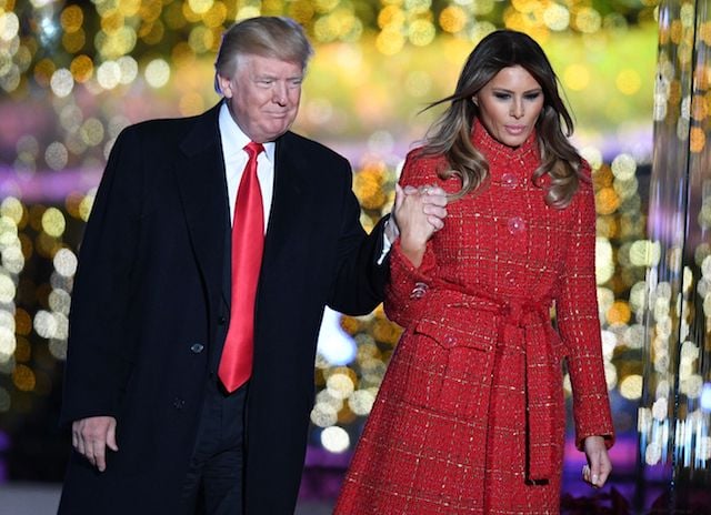 US President Donald Trump (L) and First lady Melania Trump arrive for the 95th annual National Christmas Tree Lighting ceremony at the Ellipse in President's Park near the White House in Washington, DC on November 30, 2017. / AFP PHOTO / JIM WATSON (Photo credit should read JIM WATSON/AFP/Getty Images)