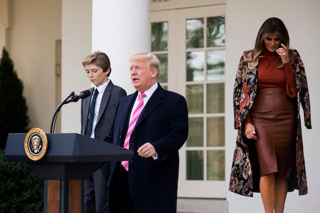 US President Donald Trump and his son Barron (L) speaks alongside First Lady Melania Trump before pardoning the Thanksgiving turkey Drumstick, in the Rose Garden of the White House in Washington, DC, on November 21, 2017. / AFP PHOTO / JIM WATSON (Photo credit should read JIM WATSON/AFP/Getty Images)