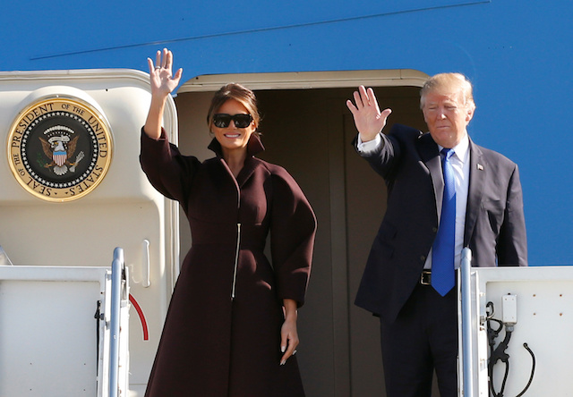 U.S. President Donald Trump and first lady Melania board Air Force One as they depart for Seoul, at U.S. Air Force Yokota base in Fussa, on the outskirts of Tokyo, Japan, November 7, 2017. REUTERS/Toru Hanai - RC1305CE3A70