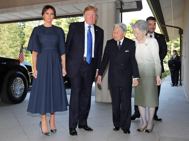 U.S. President Donald Trump, second right, and First Lady Melania Trump, left, are welcomed by Emperor Akihito, second right, and Empress Michiko, right, upon their arrival at the Imperial Palace Monday, Nov. 6, 2017 in Tokyo. REUTERS/Eugene Hoshiko/Pool - RC19FD6E0DF0