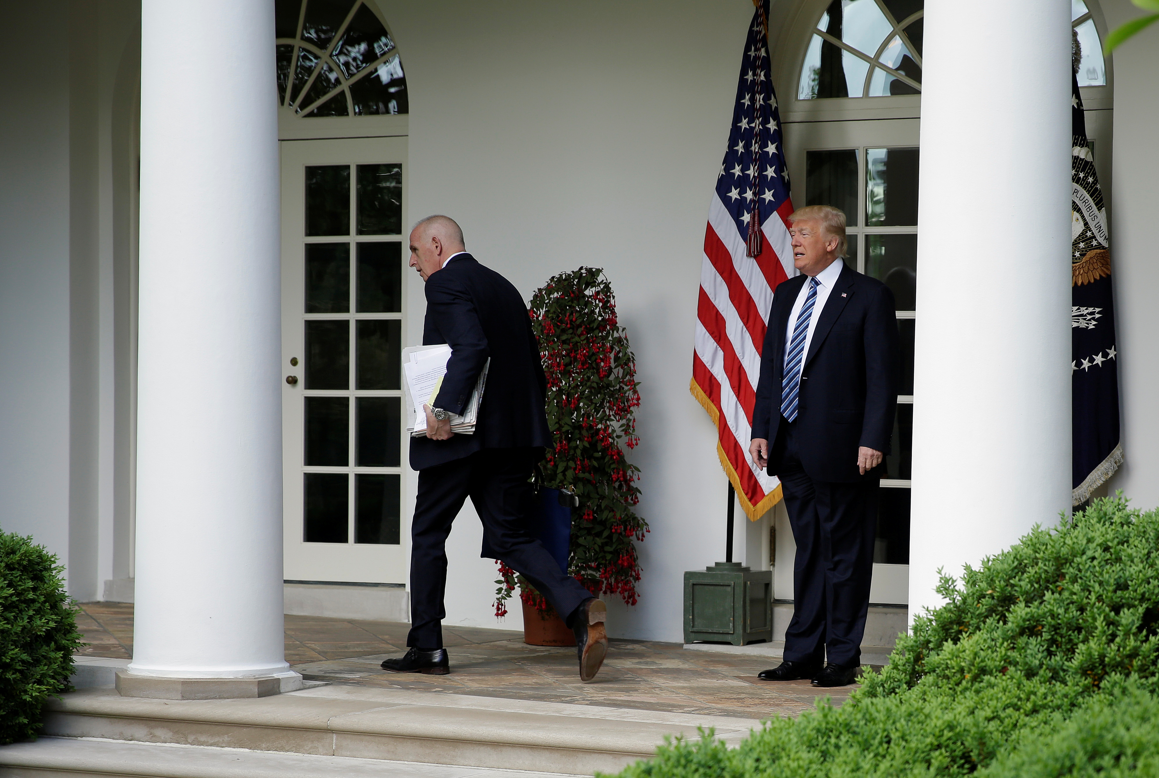 Keith Schiller, deputy assistant to the President and director of Oval Office operations, and U.S. President Donald Trump walk to the Oval Office of the White House in Washington, U.S., May 2, 2017. REUTERS/Joshua Roberts