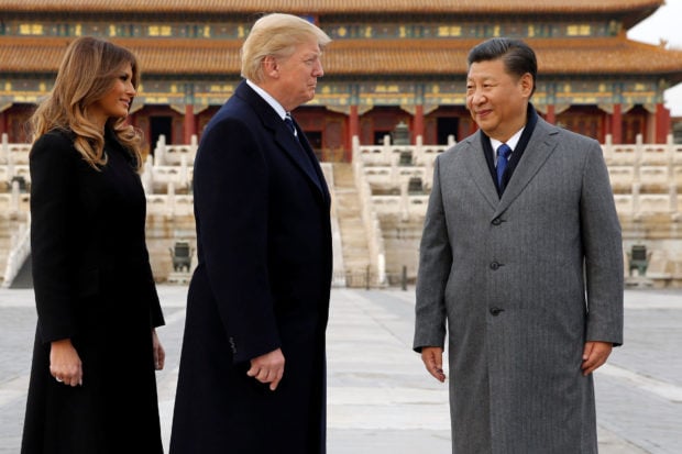 U.S. President Donald Trump and U.S. first lady Melania visit the Forbidden City with China's President Xi Jinping in Beijing, China, November 8, 2017. REUTERS/Jonathan Ernst