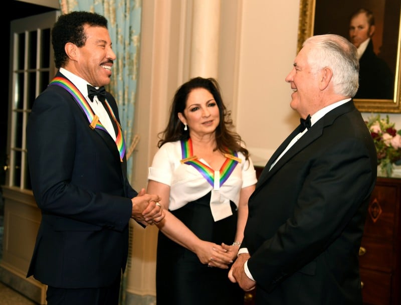 US Secretary of State Rex Tillerson (R) chats with 2017 Kennedy Center Honorees singer Lionel Ritchie (L) and Cuban-American singer Gloria Estefan at the conclusion of a gala dinner at the U.S. State Department, in Washington, U.S., December 2, 2017. REUTERS/Mike Theiler