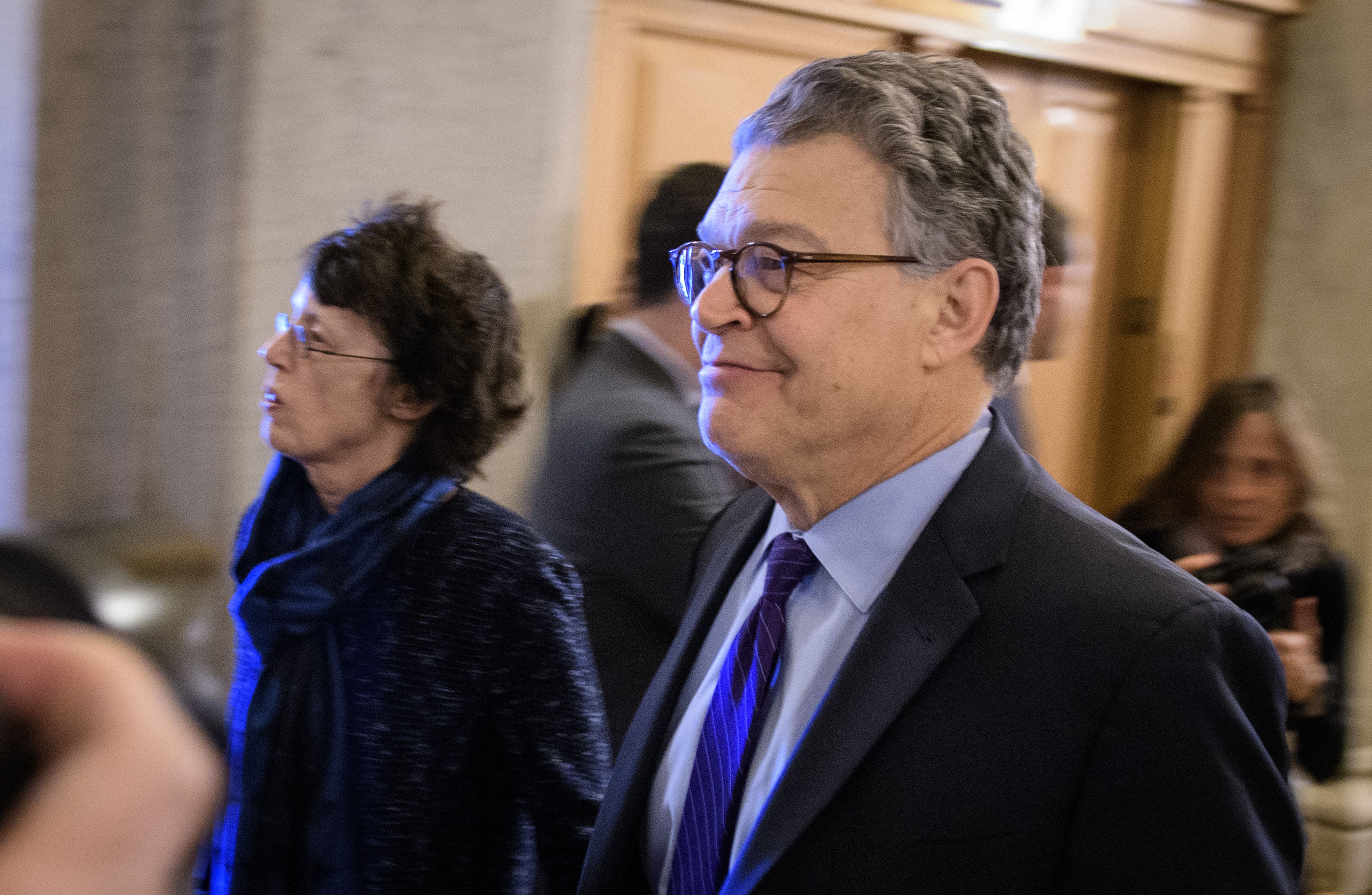 Senator Al Franken, D-MN, and his wife Franni Bryson (L) arrive at the US Capitol on December 7, 2017 in Washington, DC. Franken announced that he will be resigning in the coming weeks. Franken -- a former comedian who made his name on the popular late-night comedy show 'Saturday Night Live' before turning to politics -- has acknowledged misconduct with at least one accuser. The 66-year-old Minnesota lawmaker apologized last month and vowed to work to regain the trust of his colleagues and voters. / AFP PHOTO / MANDEL NGAN (Photo credit should read MANDEL NGAN/AFP/Getty Images)
