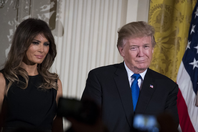 WASHINGTON, DC - DECEMBER 7: (L to R) First lady Melania Trump and U.S. President Donald Trump attend a Hanukkah Reception in the East Room of the White House, December 7, 2017 in Washington, DC. Hanukkah begins on the evening of Tuesday, December 12 this year. (Drew Angerer/Getty Images)