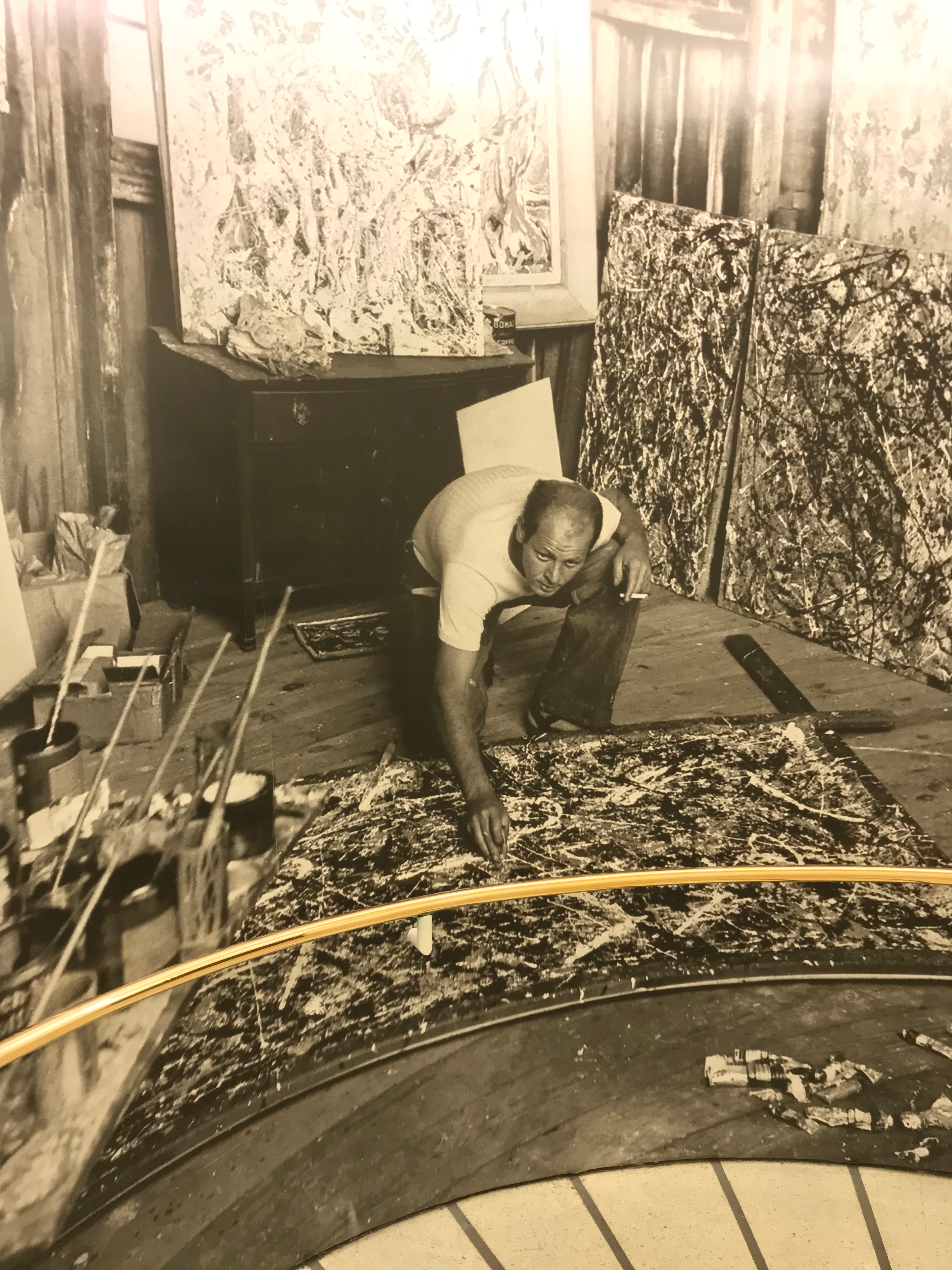 A photo of Jackson Pollock working on Alchemy was plastered on the wall in the Sackler Center for Arts Education at the Guggenheim Museum. (DCNF/Ethan Barton)