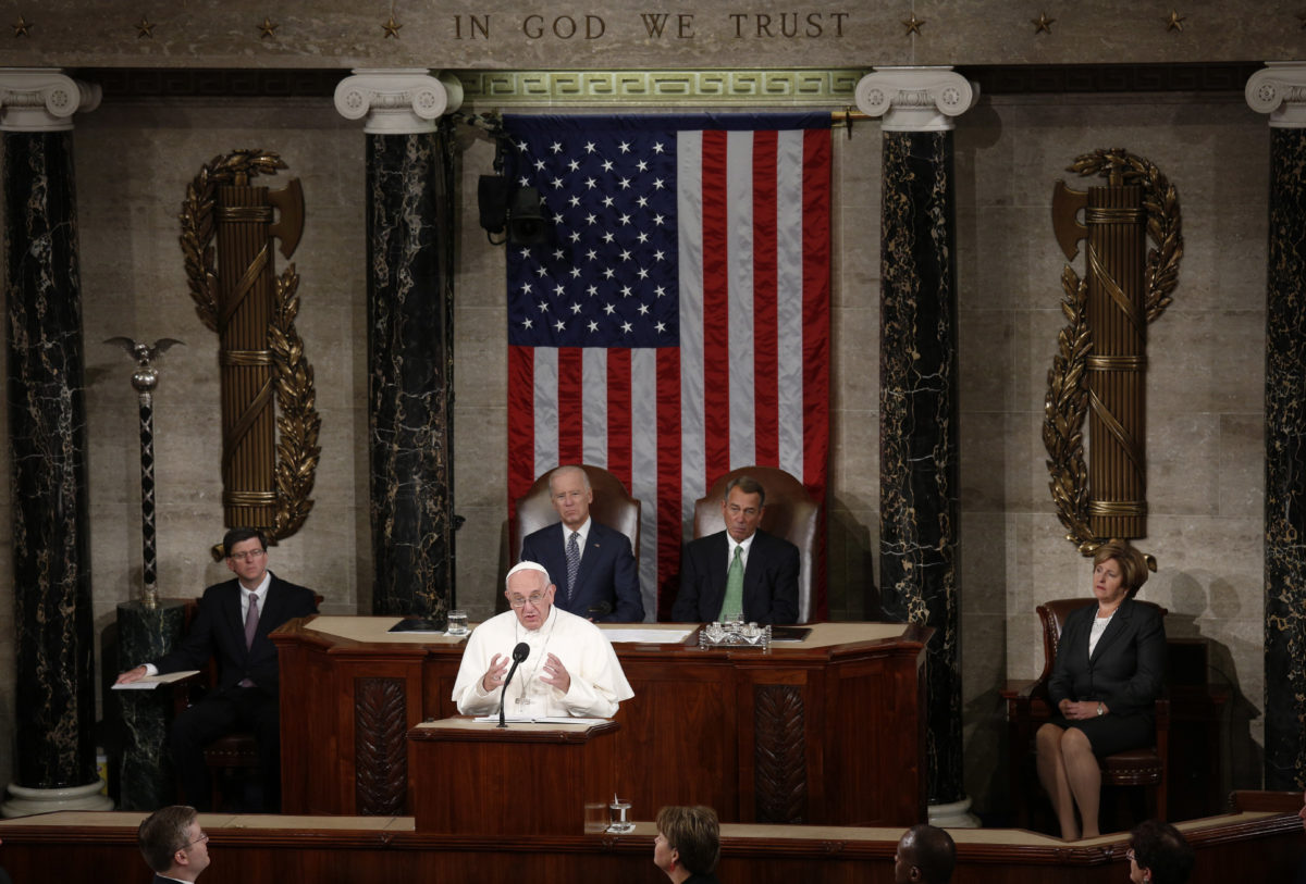 Pope Francis addresses a joint meeting of the U.S. Congress as Vice President Joe Biden (L) and Speaker of the House John Boehner (R) look on in the House of Representatives Chamber on Capitol Hill in Washington September 24, 2015. REUTERS/Kevin Lamarque