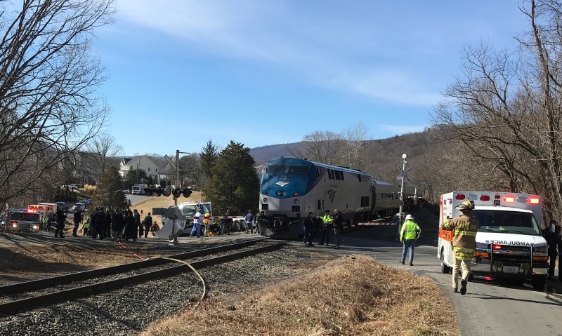 Emergency first responders work at the scene of the crash where an Amtrak passenger train carrying Republican members of the U.S. Congress from Washington to a retreat in West Virginia collided with a garbage truck in Crozet, Virginia, U.S. January 31, 2018. Justin Ide/Crozet Volunteer Fire Department/Handout via REUTERS 
