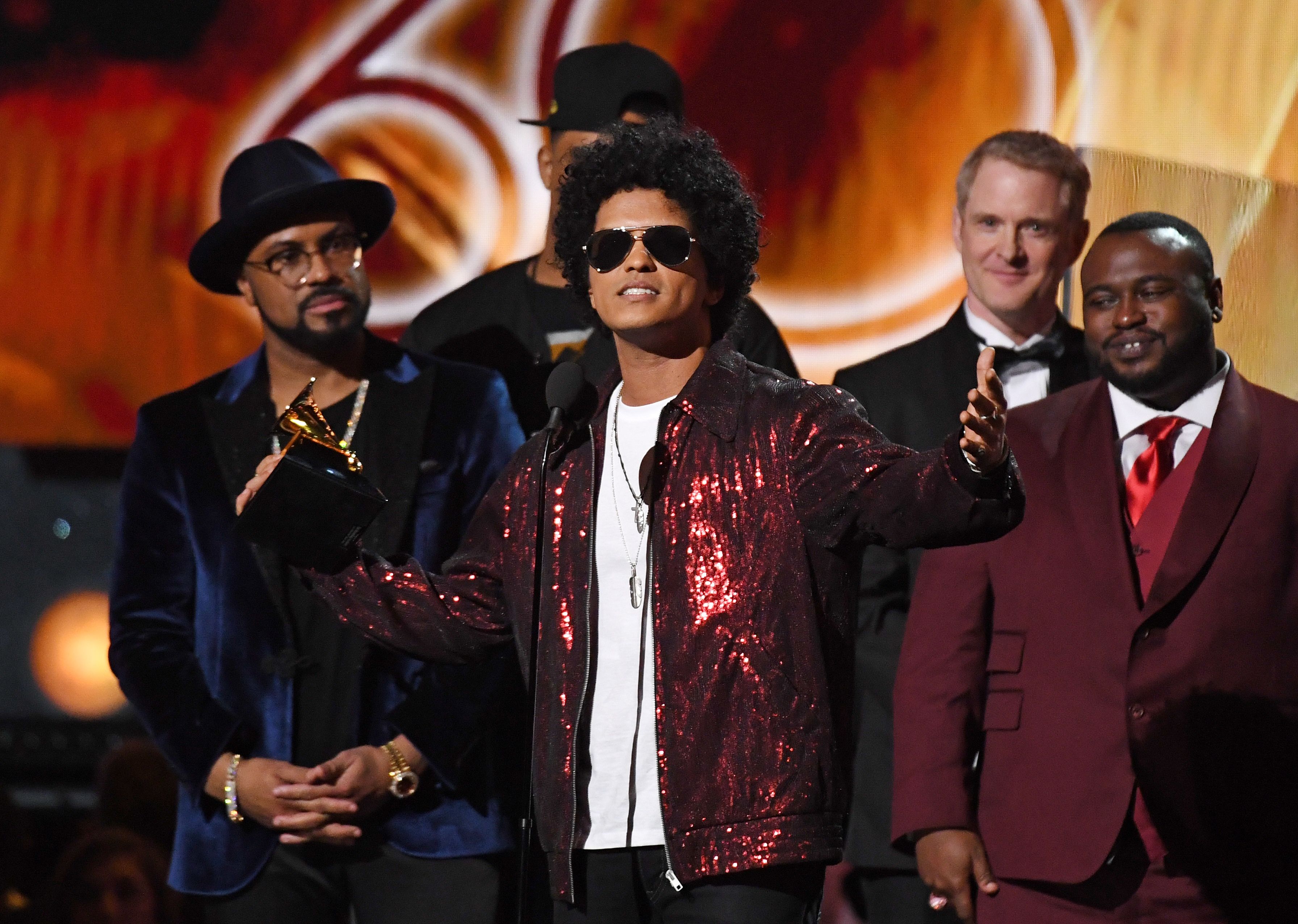 Bruno Mars receives his third Grammy for Album of the Year during the 60th Annual Grammy Awards show on January 28, 2018, in New York. / AFP PHOTO / Timothy A. CLARY (Photo credit should read TIMOTHY A. CLARY/AFP/Getty Images)