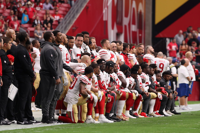 GLENDALE, AZ - OCTOBER 01: Members of the San Francisco 49ers kneel for the National Anthem before the start of the NFL game against the Arizona Cardinals at the University of Phoenix Stadium on October 1, 2017 in Glendale, Arizona. (Photo by Christian Petersen/Getty Images)