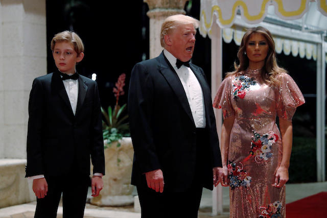 U.S. President Donald Trump and first lady Melania Trump, with their son Barron, arrive for a New Year's Eve party at his Mar-a-Lago club in Palm Beach, Florida, U.S. December 31, 2017. REUTERS/Jonathan Ernst TPX IMAGES OF THE DAY - RC1533B51780