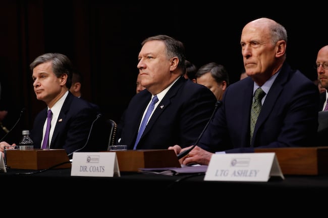 (L-R) FBI Director Christopher Wray, CIA Director Mike Pompeo, and Director of National Intelligence Dan Coats wait to testify before the Senate Intelligence Committee on Capitol Hill in Washington, February 13, 2018. REUTERS/Aaron P. Bernstein