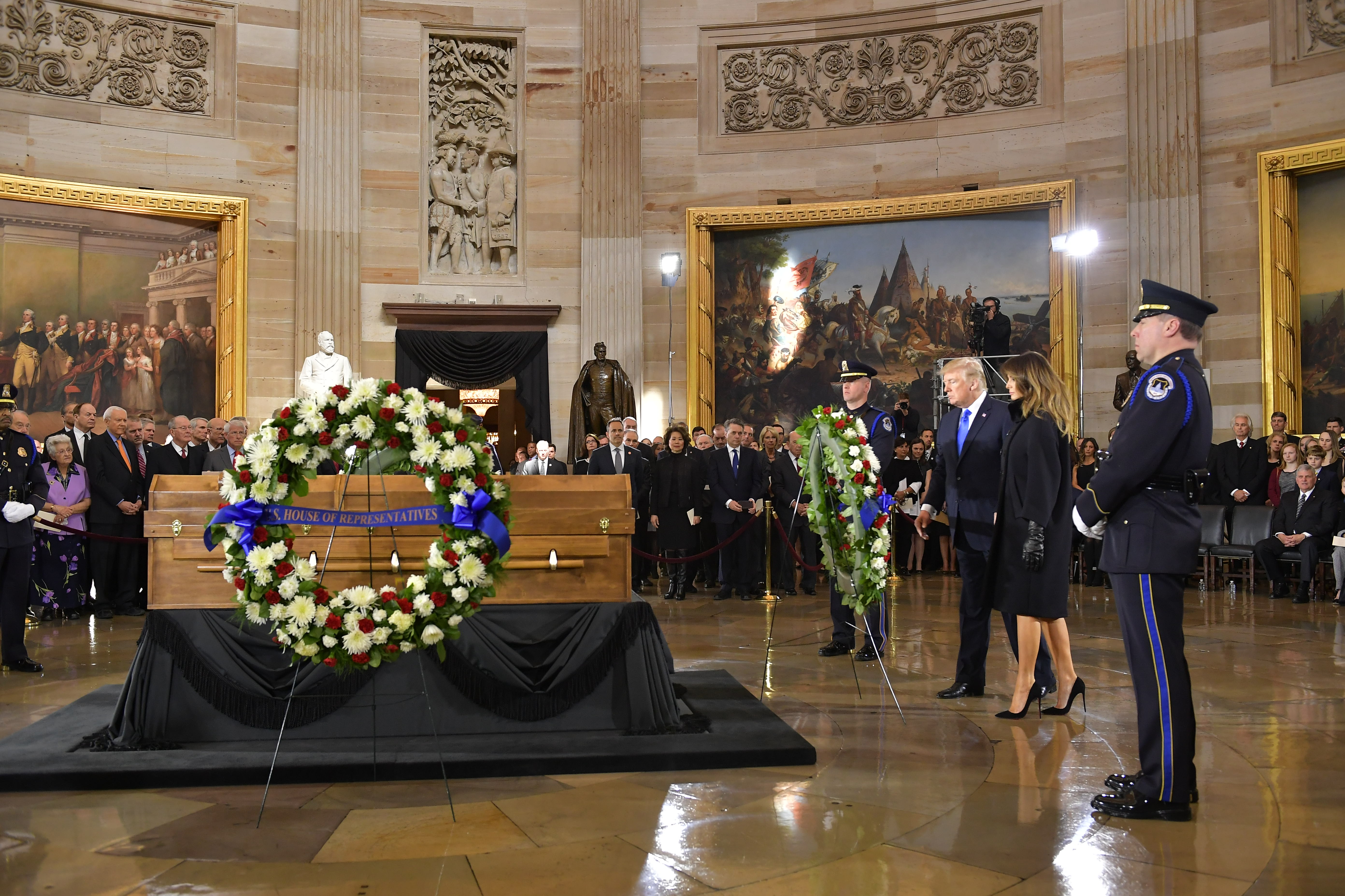 US President Donald Trump and First Lady Melania Trump pay their respects at Rev. Billy Graham's casket in the Rotunda of the U.S.Capitol in Washington, Wednesday, Feb. 28, 2018. / AFP PHOTO / Mandel NGAN (Photo credit should read MANDEL NGAN/AFP/Getty Images)