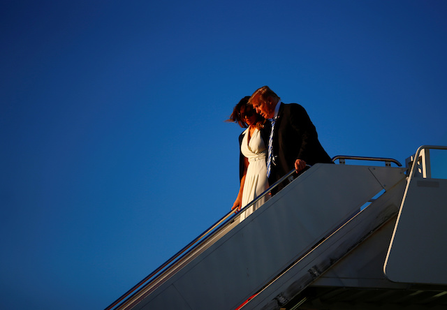 U.S. President Donald Trump and first lady Melania Trump disembark Air Force One in West Palm Beach, Florida, U.S., February 16, 2018. REUTERS/Eric Thayer
