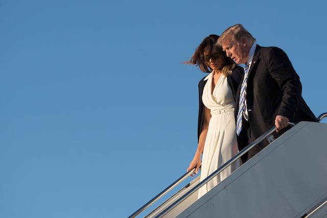 US President Donald Trump and First Lady Melania Trump arrive at Palm Beach International Airport in West Palm Beach, Florida, on February 16, 2018. / AFP PHOTO / JIM WATSON (Photo credit should read JIM WATSON/AFP/Getty Images)