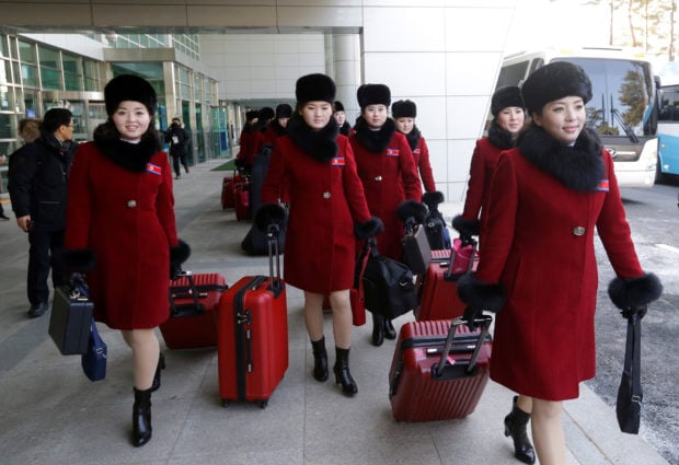 North Korean cheering squads arrive at the Korean-transit office near the Demilitarized Zone in Paju, South Korea, February 7, 2018. REUTERS/Ahn Young-joon/Pool