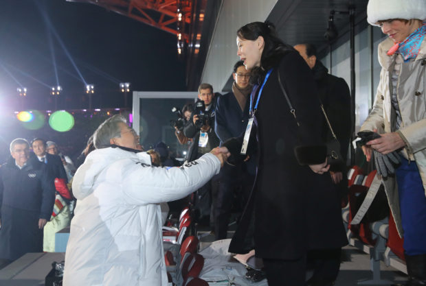 South Korean President Moon Jae-in shakes hands with Kim Jong Un's younger sister Kim Yo Jong at the Winter Olympics opening ceremony in Pyeongchang, South Korea February 9, 2018. Yonhap via REUTERS 