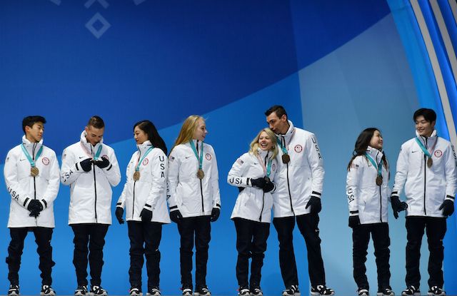 The USA team who won bronze pose on the podium during the medal ceremony for the figure skating team event at the Pyeongchang Medals Plaza during the Pyeongchang 2018 Winter Olympic Games in Pyeongchang on February 12, 2018. / AFP PHOTO / Fabrice COFFRINI (Photo credit should read FABRICE COFFRINI/AFP/Getty Images)
