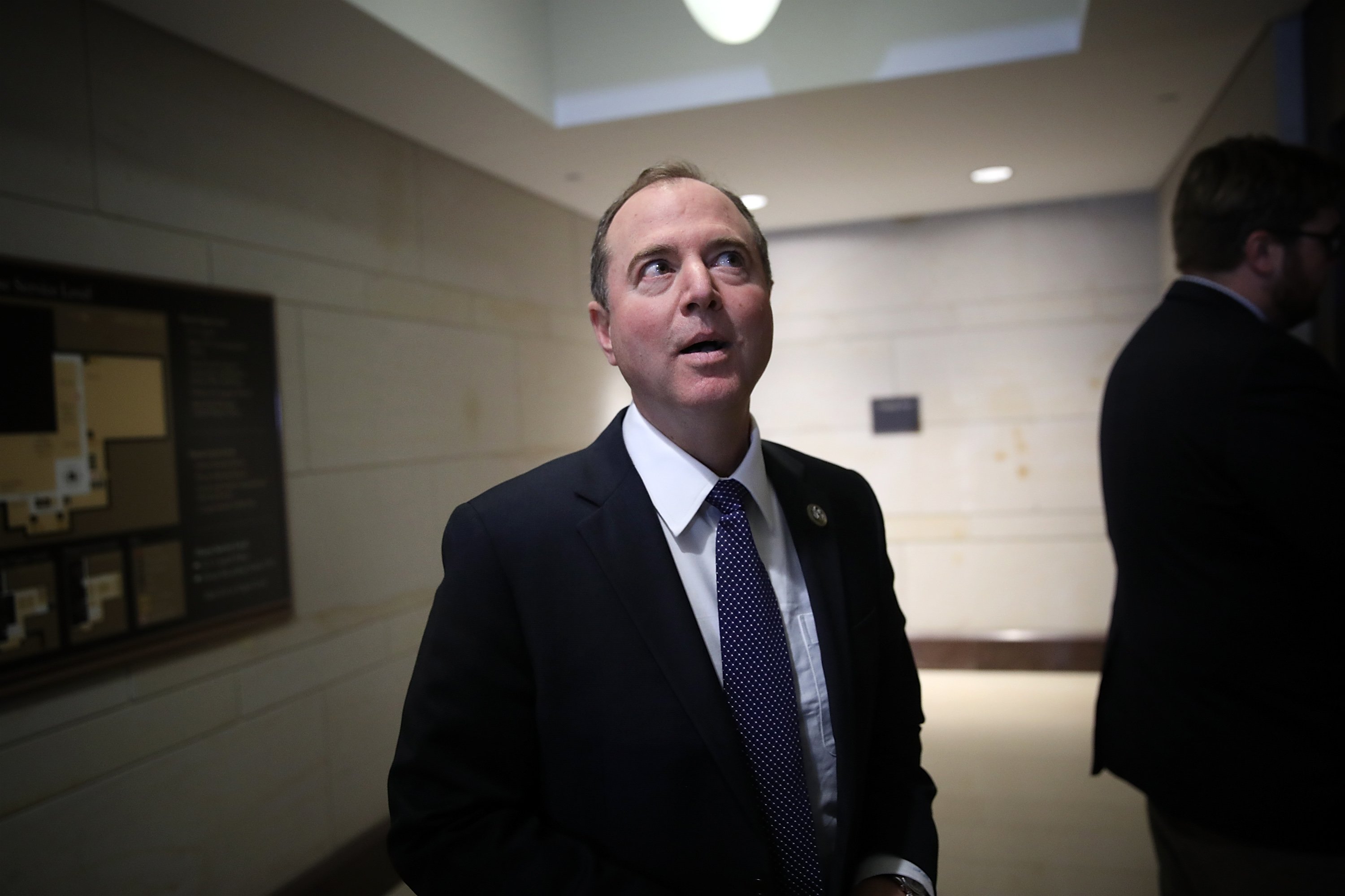 WASHINGTON, DC - FEBRUARY 05: Rep. Adam Schiff (D-CA), ranking member of the House Permanent Select Committee on Intelligence, answers brief questions from the media while boarding an elevator at the U.S. Capitol February 5, 2018 in Washington, DC. The House Permanent Select Committee on Intelligence is scheduled to meet later today to vote on the release of the minority rebuttal of a memo released last week by their Republican counterparts relating the committeeÕs investigation of Russian influence in the 2016 U.S. presidential election. (Photo by Win McNamee/Getty Images)